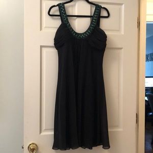 Knee length black dress with beaded neckline